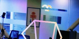 המצלמה החכמה הזאת שומרת על הפרטיות שלך בדרך חדשה ומהפכנית Yasha Iravantchi looks like an anonymous stick figure in this monitor connected to PrivacyLens. Credit: Brenda Ahearn, Michigan Engineering.